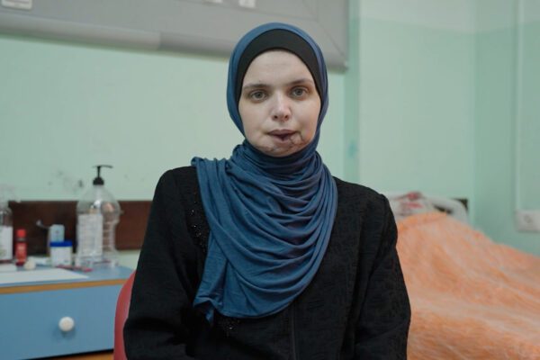 Injured Palestinian Journalist vows to keep working despite losses